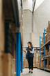 © Jacob Lund - Warehouse worker taking inventory using smart warehousing technology