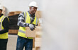 © Jacob Lund - Happy young man moving cardboard boxes in a warehouse