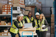 © Jacob Lund - Warehouse staff watching a laptop screen during a meeting