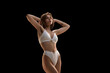 © Lustre Art Group  - Beauty portrait of young Caucasian blonde woman posing in white color underwear isolated over dark background. Concept of beauty, body and skin care, health, spa, cosmetics, ad