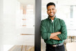© Vadim Pastuh - Successful indian authoritative confident young brunet adult male entrepreneur businessman professional in smart casual wear standing with arms crossed at the modern office, looking at the camera
