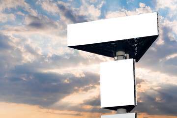 Wall Mural - mock up - two blank white billboards against warm sunset sky. sun beams shining through dramatic clo