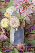  Close-up floral composition with a pink Ranunculus flowers . Beautiful bouquet of a spring flowers. 