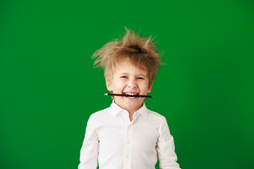 Sticker - Surprised child against green chalkboard in class