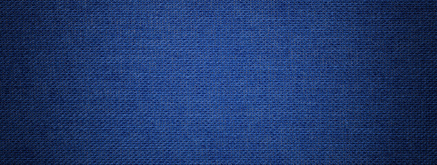 navy blue background from textile material with wicker pattern, and vignette. structure of denim fab