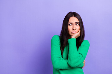 Sticker - Photo of upset bored woman wear green pullover arm chin looking emtpy space isolated purple color background