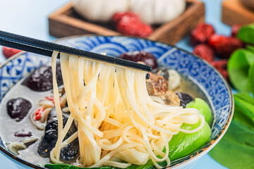 Wall Mural - A bowl of black chicken noodles