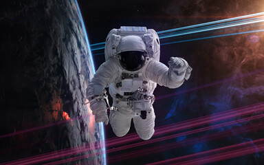 Wall Mural - Astronaut in orbit of deep space planet. Science fiction. Elements of this image furnished by NASA