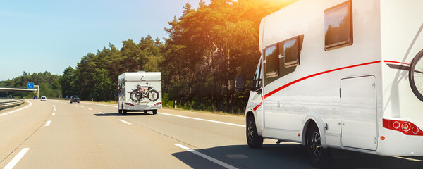 scenic view big modern white family rv camper van vehicle driving on european highway road against b
