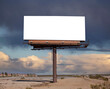© trekandphoto - Large blank billboard with desert storm sky and cut out center.