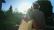 © Marco - Romantic senior couple looking at sunset together. Senior husband with arm around wife standing outdoors at park