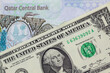 Qatari riyal bank notes paired with Egyptian pound money