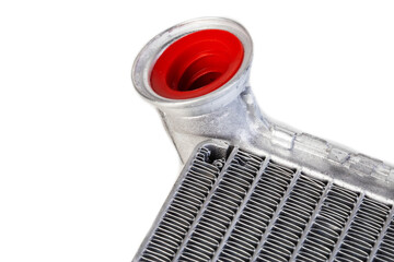 Part of a car heater radiator on a white background, close-up. Automotive spare part. Close-up