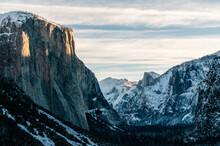 Telephoto Shot Of El Capitan Catching The First Rays Of Sunlight. Yosemite National Park On A Winter Morning.