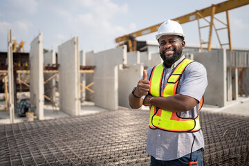 Wall Mural - Portrait African American engineer man working with precast cement factory background	