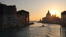 The Grand Canal In Venice With The Silhouette Of The Santa Maria Della Salute Basilica At Sunrise, Italy, Europe.