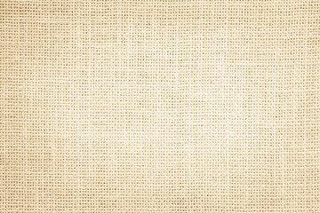 jute hessian sackcloth canvas woven texture pattern background in light beige cream brown color blan