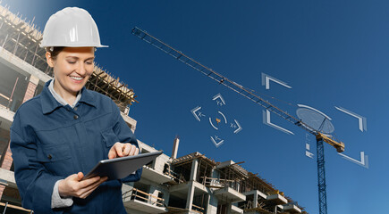Aufkleber - Woman with a digital tablet controls a remote-controlled unmanned crane. Digital transformation in construction industry.