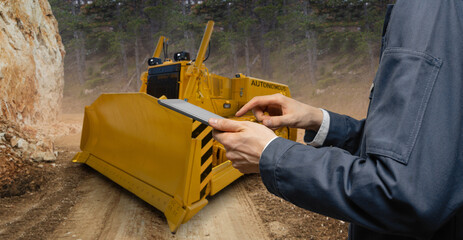 Aufkleber - Engineer programs autonomous bulldozer using digital tablet 