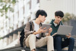 © NINENII - Students Reading Books In University Campus, summer vacation.
