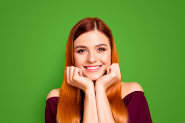 Sticker - Portrait of red straight-haired attractive cute nice happy smiling young girl, chin on hands. Isolated over bright vivid yellow background