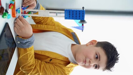 Wall Mural - robotics programming class. children construct and code robot. stem education using constructor bloc