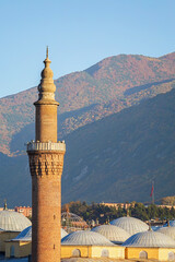 Wall Mural - Minaret of Ulu Camii, historical mosque built by Bayezid I between 1396-1400. Famouse landmark in Bursa, Turkey. Religion and history concept