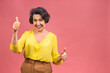 © denis_vermenko - Senior happy aged business woman wearing glasses. Beautiful old woman, grandmother looking at camera and smiling. Isolated on pink background. Thumbs up.