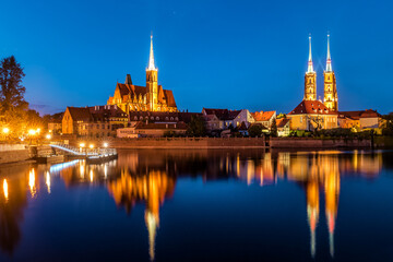 wroclaw. poland. view at tumski island and cathedral of st john the baptist with bridge through rive