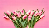 Fototapeta Tulipany - Bouquet of pink tulips flowers on pastel pink background