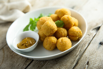 Canvas Print - Homemade salmon croquettes with mustard