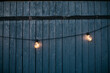 © Johnér - String lights against wooden wall