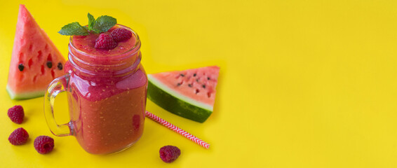 Wall Mural - Smoothie from watermelon and raspberry on the yellow background. Copy space. Close-up.