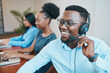 © Meeko Media - An attractive Black man speaks to client on headset remote call, smiling