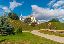 Dmitrov, Russia. View Of The Earthen Rampart Of The Dmitrovsky Kremlin With Cathedral Of The Assumption Of The Blessed Virgin Mary And Bellfry.