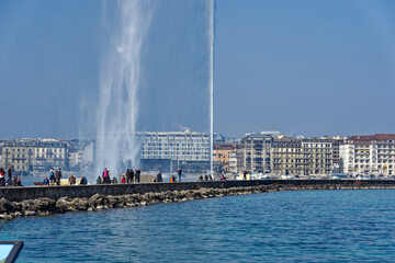 Wall Mural - Beautiful and famous jet d'eau water fountain at Lake Geneva at Swiss City of Geneva on a sunny winter day. Photo taken March 5th, 2023, Geneva, Switzerland.