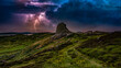 © Susan Halewood - Ruined moorland castle tower during lightning storm