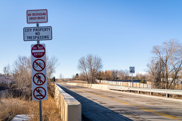 dedicated bus corridor with warning road signs in Fort Collins, Colorado, rapid transit public tranportation