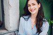 © Zamrznuti tonovi - Portrait of a beautiful woman sitting in a street cafe