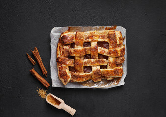 Puff pastry bun with jam, cinnamon and brown sugar, close up view. pastry concept. top view