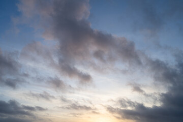 Wall Mural - Cloudscape at golden hour with blue sky and warm clouds