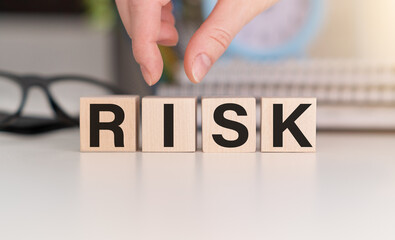 Risk and Rise text on wooden block. risk concept idea.