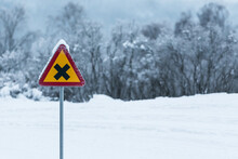 Road Sign In A Winter Landscape