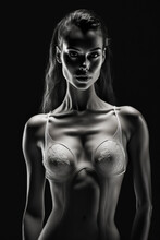Low Key Portrait Of A Young Beautiful Brunette Woman In A Stylish Lingerie, Isolated On Black Background. Generative AI