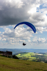 Serra Negra, Sao Pualo, Brasil. March, 17, 2022. Paragliding flying over the region, at the viewpoint of Serra Alto da Serra, located in the city of Serra Negra.