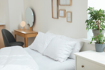 Wall Mural - Bed with soft white pillows in cozy room interior