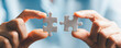 © JD8 - Business woman person hand holding puzzle piece idea for strategy and solution. Closeup part of two white jigsaw connect together. Concept of join cooperation success teamwork-problem corporate team