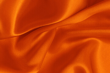 Wall Mural - Orange fabric cloth texture for background and design art work, beautiful crumpled pattern of silk or linen.