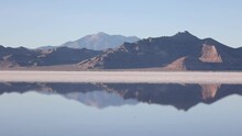 White Salt Flats Crust Making Reflection On The Western Edge Of The Great Salt Lake Basin In Utah, United States Of America. Salt Flats Are Comprised Mostly Of Sodium Chloride, Or Table Salt.