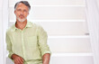 © Yuri A for PeopleImages/peopleimages.com - Hes got great workplace confidence. Portrait of a mature businessman sitting on stairs.